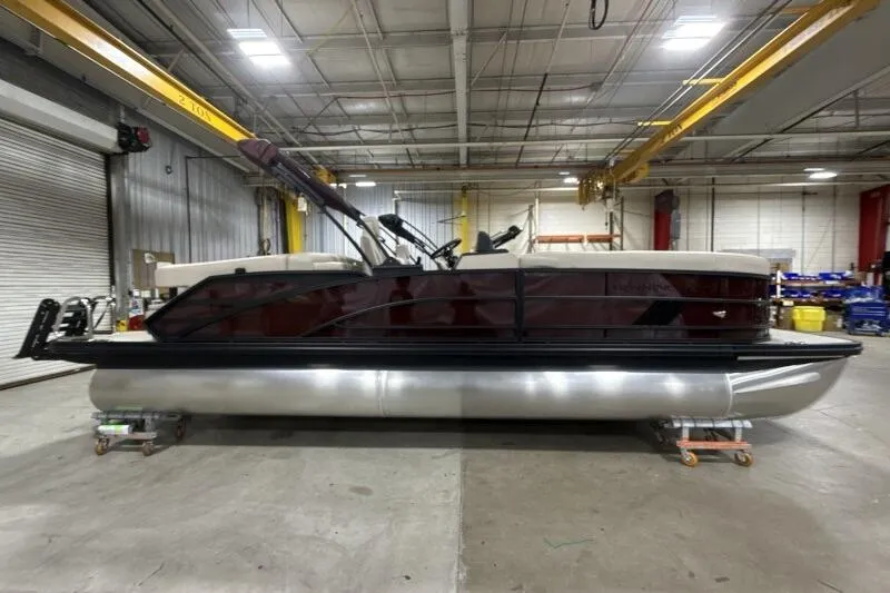 2026 Bennington 24 MOFBSF pontoon boat in a warehouse setting.