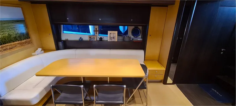  Yacht Photos Pics Interior of 2012 Riva 63 Virtus yacht with dining area and modern furnishings.