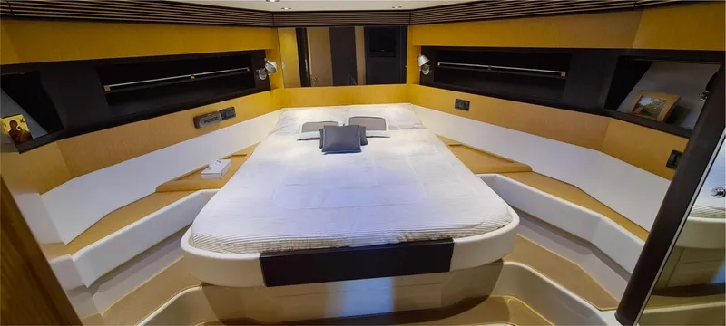  Yacht Photos Pics Luxurious cabin interior of 2012 Riva 63 Virtus yacht with modern design and cozy bed.