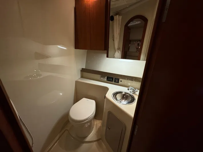  Yacht Photos Pics Compact bathroom in 2011 Rampage 34 IPS boat with toilet and sink.