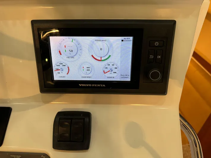  Yacht Photos Pics Volvo Penta display on 2011 Rampage 34 IPS boat dashboard, showing engine metrics.
