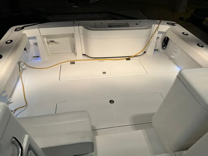  Yacht Photos Pics 2011 Rampage 34 IPS boat interior with white seating and storage compartments.