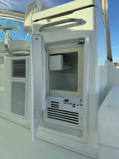  Yacht Photos Pics 2011 Rampage 34 IPS boat with open onboard refrigerator, showcasing interior storage.