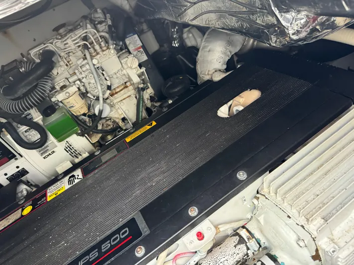  Yacht Photos Pics Engine compartment of a 2011 Rampage 34 IPS boat, showcasing mechanical components.