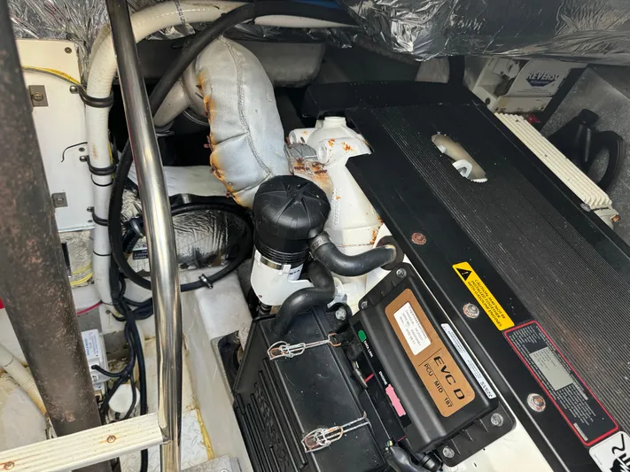  Yacht Photos Pics Engine room of a 2011 Rampage 34 IPS boat, showcasing mechanical components and wiring.