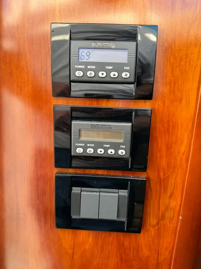  Yacht Photos Pics Control panel on 2011 Rampage 34 IPS boat, featuring digital displays and switches.