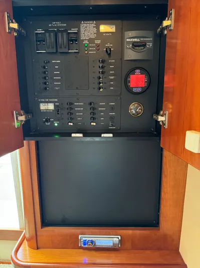  Yacht Photos Pics Electrical control panel inside a 2011 Rampage 34 IPS boat, featuring switches and gauges.