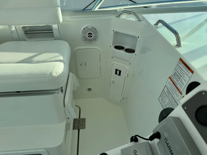  Yacht Photos Pics 2011 Rampage 34 IPS boat interior with white seating and control panel.