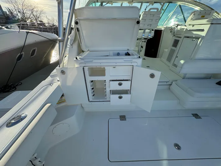  Yacht Photos Pics 2011 Rampage 34 IPS boat interior with open storage compartments and seating area.
