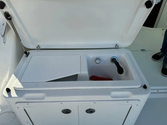  Yacht Photos Pics Open sink and storage area on 2011 Rampage 34 IPS boat.