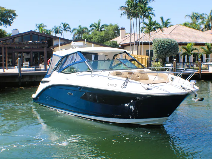 Soiral V Yacht Photos Pics 2021 Sea Ray 320 Sundancer yacht docked near waterfront homes.