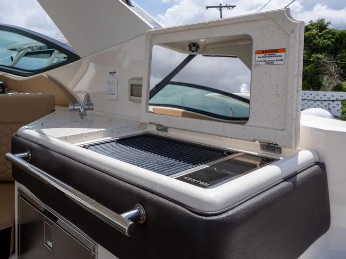 Soiral V Yacht Photos Pics Outdoor kitchenette on 2021 Sea Ray 320 Sundancer yacht with grill and sink.