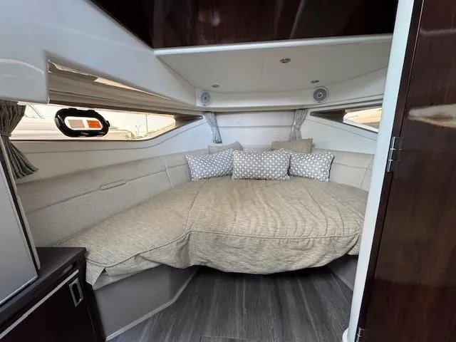 Soiral V Yacht Photos Pics 2021 Sea Ray 320 Sundancer cabin with cozy bed and modern interior design.