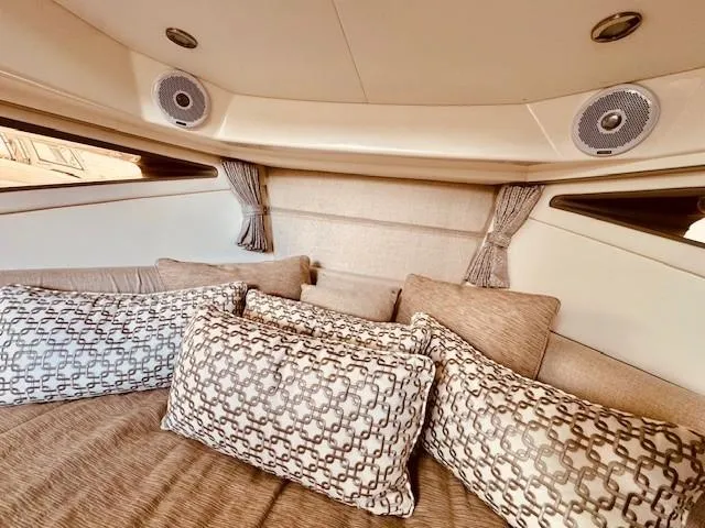 Soiral V Yacht Photos Pics Luxurious interior of 2021 Sea Ray 320 Sundancer with plush cushions and elegant design.