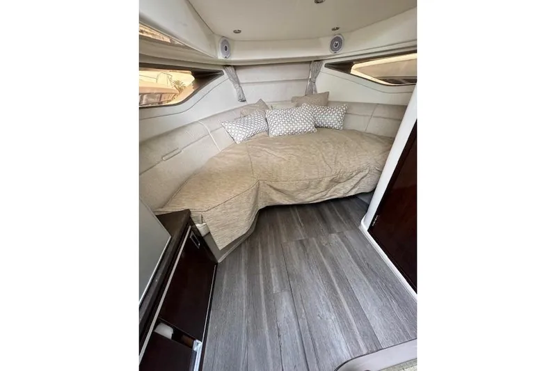 Soiral V Yacht Photos Pics Interior cabin of 2021 Sea Ray 320 Sundancer with cozy bed and modern decor.