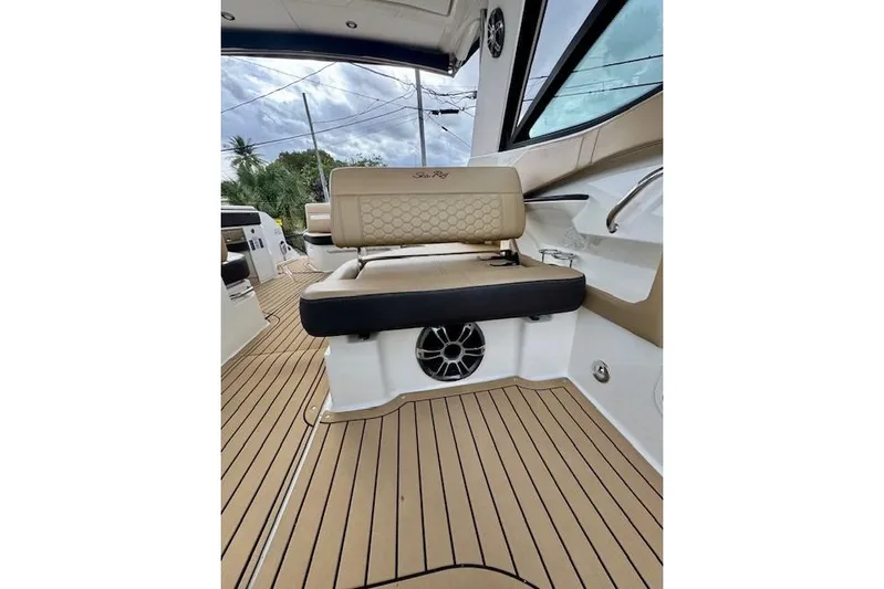 Soiral V Yacht Photos Pics 2021 Sea Ray 320 Sundancer interior with tan seating and teak flooring.
