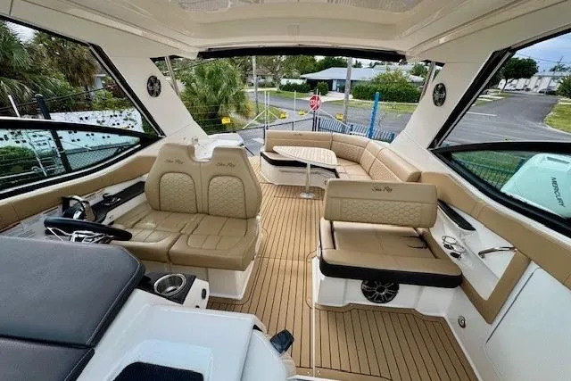 Soiral V Yacht Photos Pics 2021 Sea Ray 320 Sundancer interior with luxurious seating and modern design.