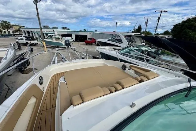Soiral V Yacht Photos Pics 2021 Sea Ray 320 Sundancer boat with spacious deck and luxurious seating in marina.