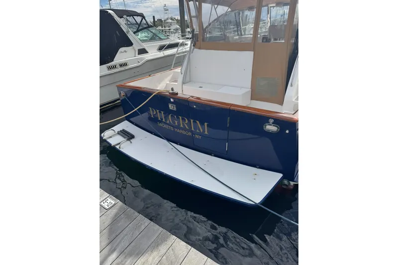 Pilgrim Yacht Photos Pics 2001 Legacy Soft Top boat named "Pilgrim" docked at Sackets Harbor.