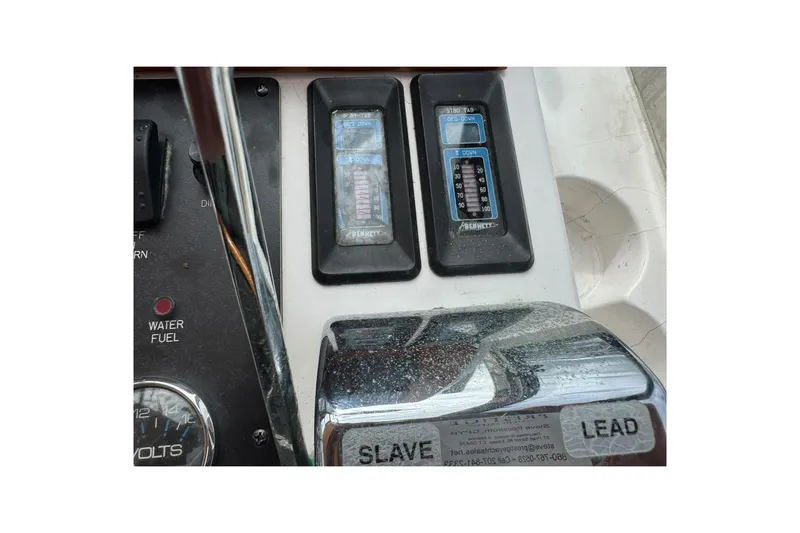 Pilgrim Yacht Photos Pics Control panel of a 2001 Legacy Soft Top boat with gauges and switches.