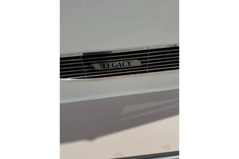 Pilgrim Yacht Photos Pics Legacy Soft Top 2001 emblem on a white surface with grille detail.