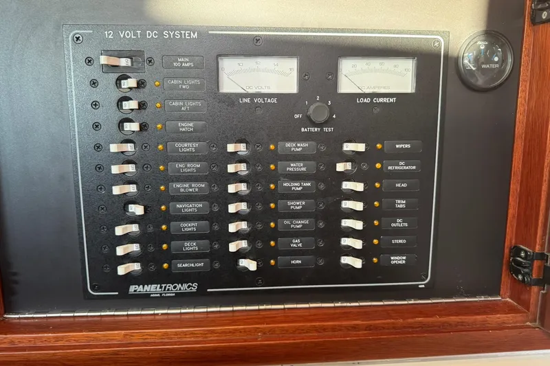 Pilgrim Yacht Photos Pics 2001 Legacy Soft Top 12V DC system panel with switches and gauges.
