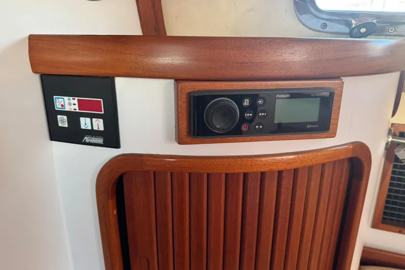 Pilgrim Yacht Photos Pics 2001 Legacy Soft Top interior with control panel and wooden accents.