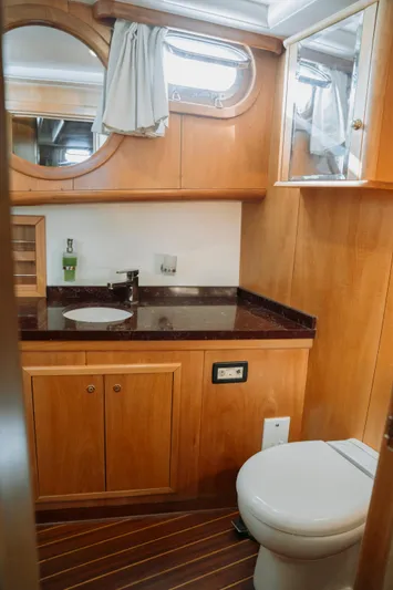  Yacht Photos Pics Luxurious bathroom in 2005 custom-made gulet with wooden cabinetry and modern fixtures.