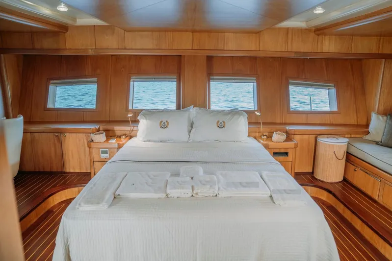  Yacht Photos Pics Luxurious cabin interior of a 2005 custom-made 30M gulet with ocean view windows.