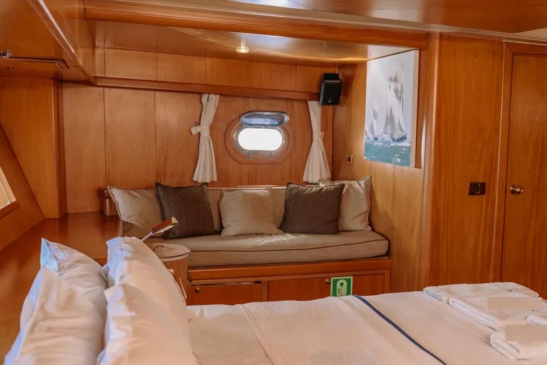  Yacht Photos Pics Luxurious cabin interior of 2005 Custom 30M Gulet with cozy seating and nautical decor.