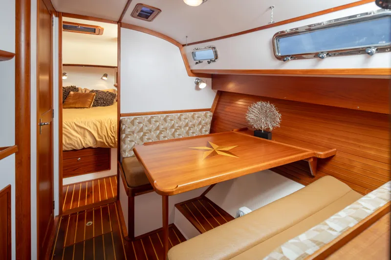 Peddler Yacht Photos Pics Luxurious 2007 Bruckmann BLUESTAR yacht interior with elegant wood finish and cozy seating area.