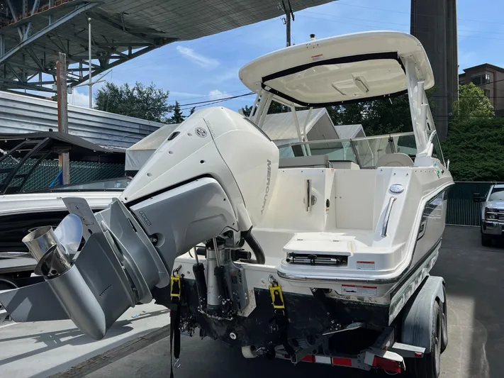  Yacht Photos Pics 2022 Boston Whaler 240 Vantage boat on trailer, featuring powerful Mercury outboard engine.