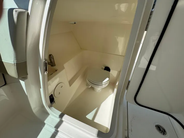  Yacht Photos Pics Interior view of 2022 Boston Whaler 240 Vantage boat's compact bathroom.