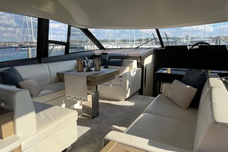 Kuramati III Yacht Photos Pics Luxurious interior of a 2016 Prestige 500 yacht with elegant seating and decor.