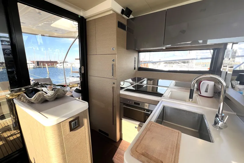 Kuramati III Yacht Photos Pics Luxurious 2016 Prestige 500 yacht kitchen with modern appliances and marina view.