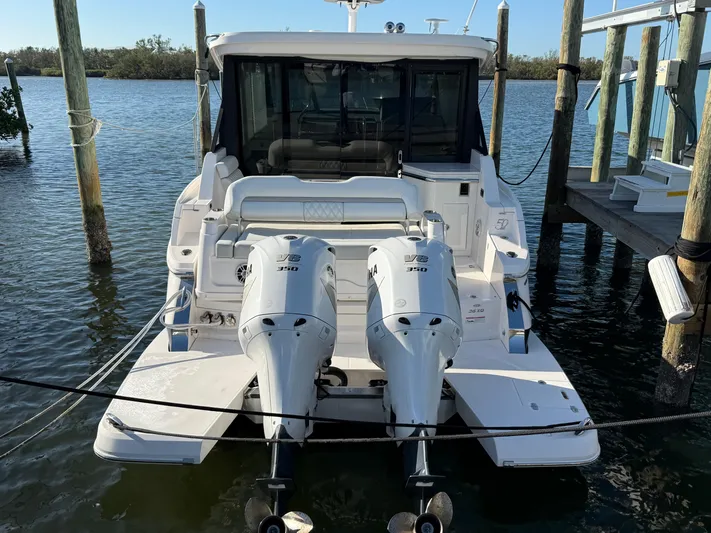  Yacht Photos Pics 2021 Regal 36 XO boat docked with twin outboard engines.