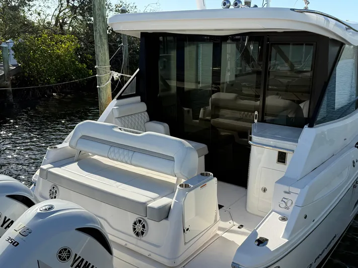  Yacht Photos Pics 2021 Regal 36 XO yacht with Yamaha engines, featuring a sleek white exterior and comfortable seating.