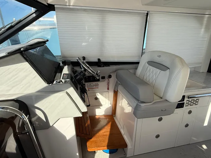  Yacht Photos Pics Interior helm of 2021 Regal 36 XO boat with modern controls and seating.