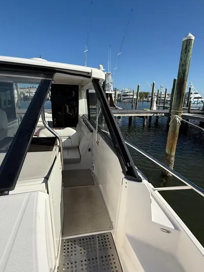  Yacht Photos Pics 2021 Regal 36 XO yacht docked at marina, showcasing sleek design and spacious deck.