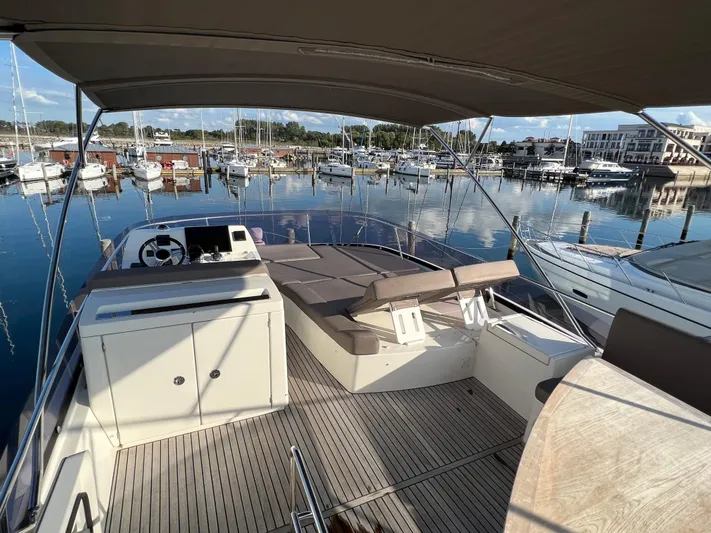 Kuramati III Yacht Photos Pics Prestige 500 yacht, 2016 model, docked in marina with spacious deck and seating area.