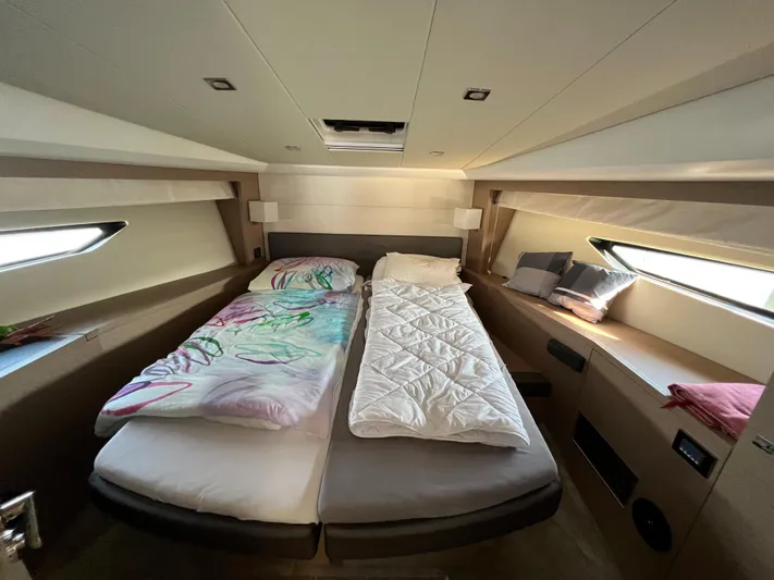 Kuramati III Yacht Photos Pics Luxurious cabin interior of a 2016 Prestige 500 yacht with twin beds and modern design.