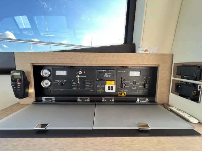 Kuramati III Yacht Photos Pics Control panel of a 2016 Prestige 500 yacht with communication device.