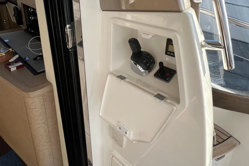 Kuramati III Yacht Photos Pics Control panel on a 2016 Prestige 500 yacht, featuring joystick and digital display.