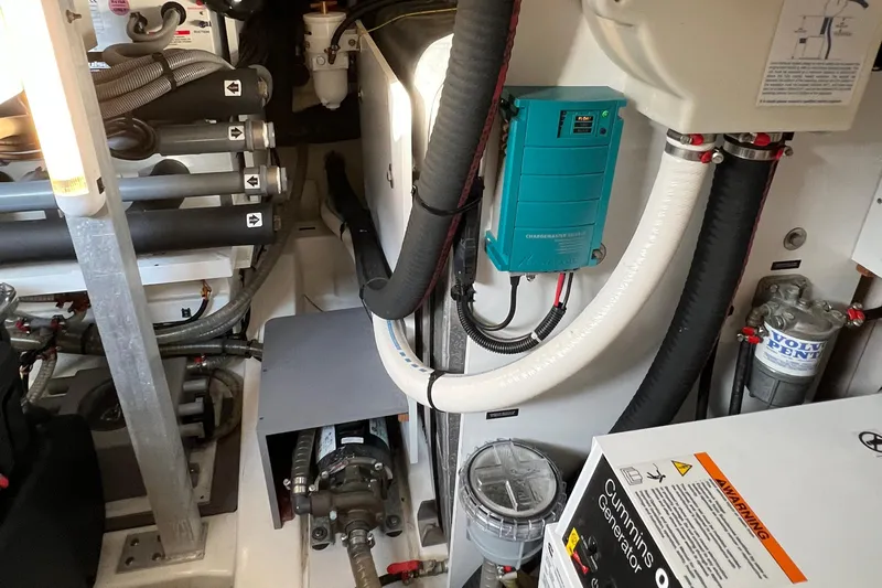 Kuramati III Yacht Photos Pics Engine room of 2016 Prestige 500 yacht with Cummins components and various mechanical systems.