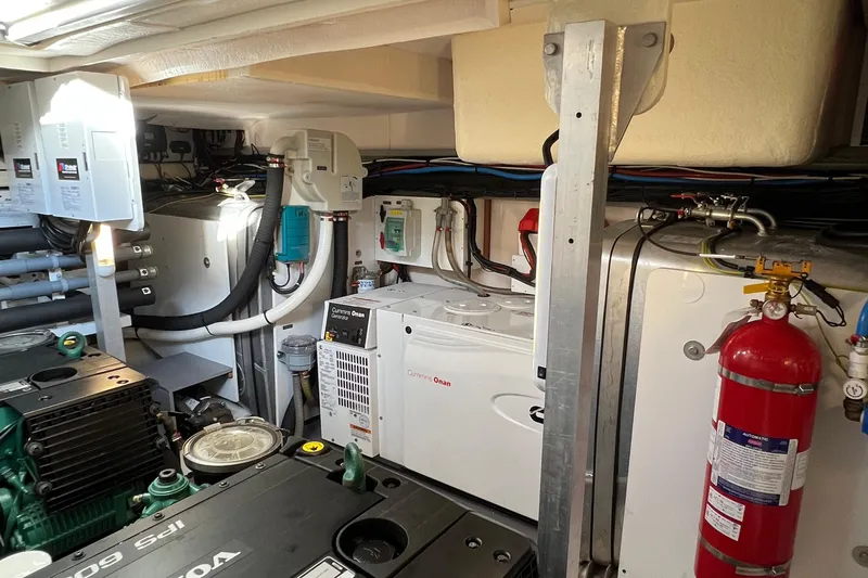 Kuramati III Yacht Photos Pics Engine room of a 2016 Prestige 500 yacht with equipment and fire extinguisher.