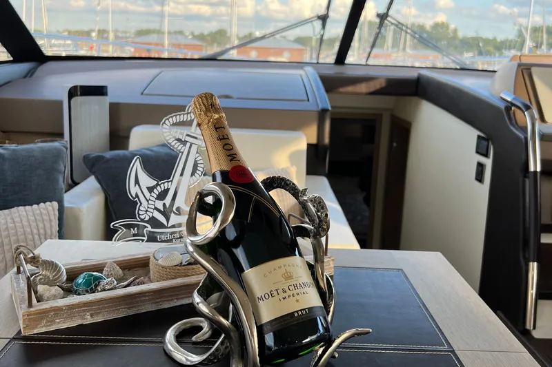 Kuramati III Yacht Photos Pics Luxurious interior of a 2016 Prestige 500 yacht with Mo&euml;t & Chandon champagne.