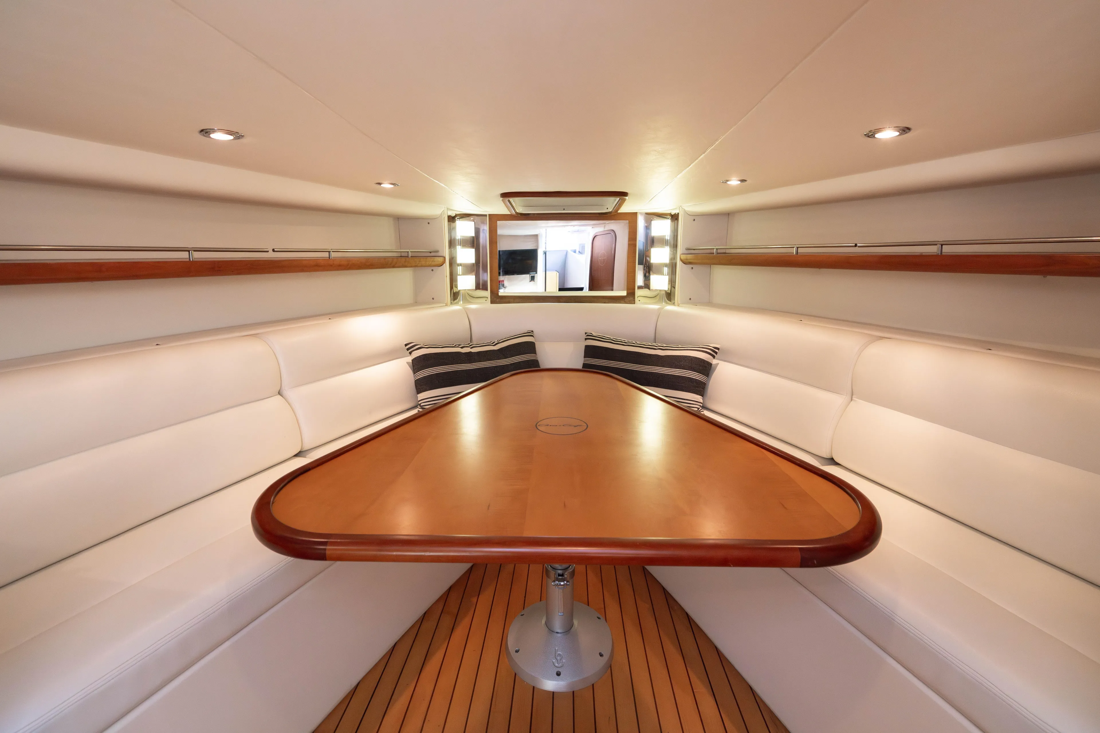 Zingaro Yacht Photos Pics Luxurious 2007 Chris Craft Corsair cabin interior with elegant seating and wooden table.