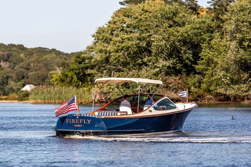 Firefly Yacht Photos Pics 2003 Hinckley T29R boat "Firefly" cruising on a scenic river.