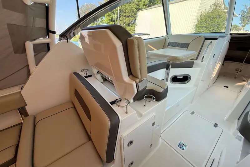  Yacht Photos Pics 2019 Pursuit DC 325 Dual Console interior with beige seating and modern design.