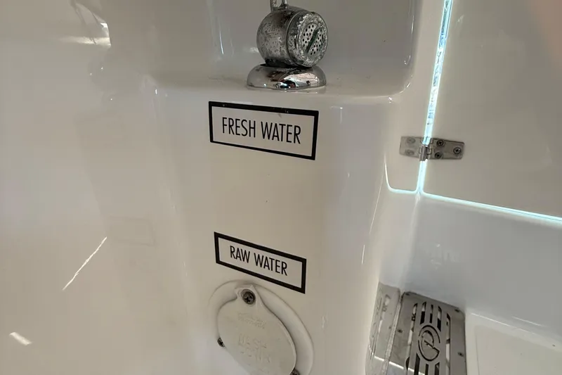  Yacht Photos Pics Fresh and raw water controls on 2019 Pursuit DC 325 Dual Console boat.